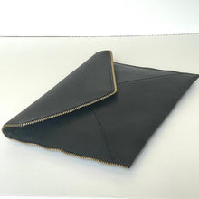Load image into Gallery viewer, Black leather clutch with gold trim on a white background