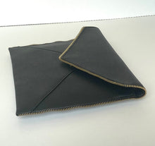 Load image into Gallery viewer, Black leather clutch with gold zipper on a white background