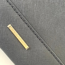 Load image into Gallery viewer, Close-up of a gray textured surface with a gold label on a white background