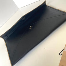 Load image into Gallery viewer, Black leather clutch bag on a light gray background