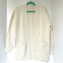 Load image into Gallery viewer, Cream-colored cable knit cardigan on a hanger against a white background