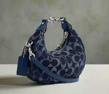 Load image into Gallery viewer, Blue handbag with a pattern on a white background