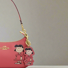 Load image into Gallery viewer, Coach x Peanuts 2025 Lucy Leather Bag Charm Keychain CBG58 Pink Anniversary