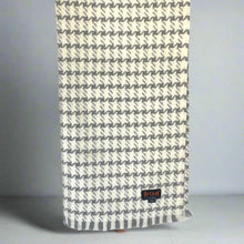 Load image into Gallery viewer, A lightweight, cream and gray houndstooth throw blanket with a fringed edge, displayed on a light background.