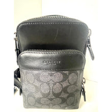 Load image into Gallery viewer, Coach crossbody bag with floral pattern on a white background