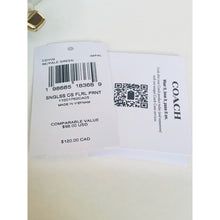 Load image into Gallery viewer, Coach label with product details and barcode on a white background