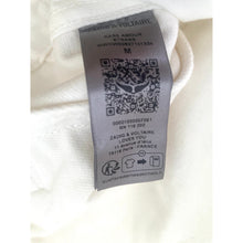 Load image into Gallery viewer, Clothing label with QR code on a white background