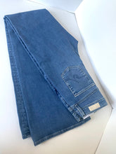 Load image into Gallery viewer, A pair of folded blue denim jeans displayed on a clean white surface, showing the back pocket and waistband details.