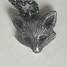Load image into Gallery viewer, Silver leaf-shaped pendant on a chain against a light background