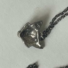 Load image into Gallery viewer, Silver turtle pendant on a chain against a light gray background