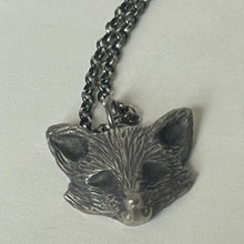 Load image into Gallery viewer, Silver fox pendant on a chain against a light gray background