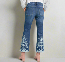 Load image into Gallery viewer, Flared jeans with floral embroidery on a light blue background