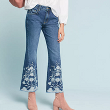 Load image into Gallery viewer, Flared jeans with floral embroidery on a light blue background