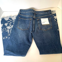 Load image into Gallery viewer, Blue jeans with a floral pattern on a white background