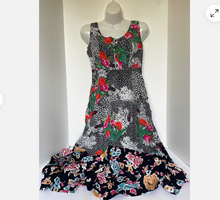 Load image into Gallery viewer, Floral dress on a mannequin against a white background