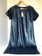Load image into Gallery viewer, A short-sleeve, crew-neck dress covered in shimmering blue sequins, hanging on a wooden hanger against a plain light background.
