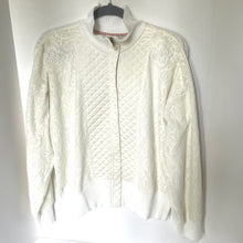 Load image into Gallery viewer, White cable knit sweater on a hanger against a white background