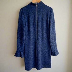 Blue patterned dress on a white background