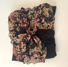 Load image into Gallery viewer, Floral patterned fabric with a large bow on a white background