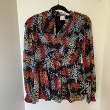Load image into Gallery viewer, Multicolored patterned blouse on a hanger against a white background
