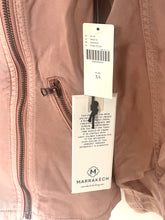 Load image into Gallery viewer, Close-up of a jacket with a tag displaying the brand 'Marrakech'.