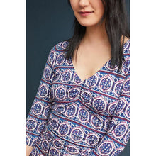 Load image into Gallery viewer, Woman wearing a patterned dress with a plain background