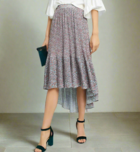 Load image into Gallery viewer, Person wearing a floral skirt with a plain background