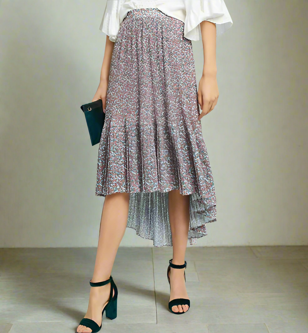 Person wearing a floral skirt with a plain background