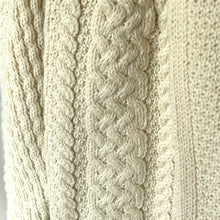 Load image into Gallery viewer, Close-up of a textured beige fabric with a cable knit pattern