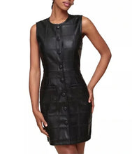 Load image into Gallery viewer, A sleeveless black faux-leather dress with a quilted patchwork pattern, front button closure, and side pockets, shown on a model against a white background.