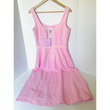 Load image into Gallery viewer, Pink checkered dress on a hanger against a white background