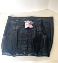 Load image into Gallery viewer, A folded black faux-leather vest with a quilted chain-link pattern and three front buttons, still attached to pink retail tags, displayed on a white surface.