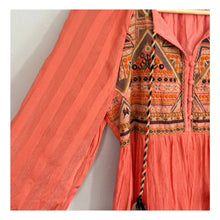 Load image into Gallery viewer, Coral pink dress with intricate patterned top against a white background