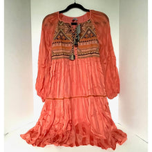 Load image into Gallery viewer, Coral dress with intricate patterns on a hanger against a white background