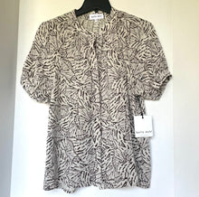 Load image into Gallery viewer, Zebra print blouse on a hanger with a visible brand tag against a white background