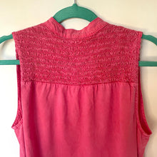 Load image into Gallery viewer, Pink sleeveless top on a green hanger against a white background