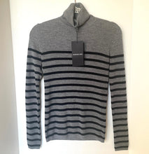 Load image into Gallery viewer, Gray and black striped sweater with a tag on a white background