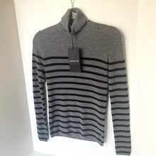 Load image into Gallery viewer, Gray and black striped sweater with a tag on a white background