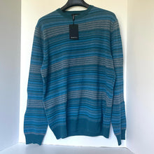 Load image into Gallery viewer, Blue striped sweater on a hanger against a white background