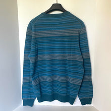 Load image into Gallery viewer, Blue striped sweater on a hanger against a white background