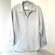 Load image into Gallery viewer, Light gray button-up shirt on a hanger against a white background
