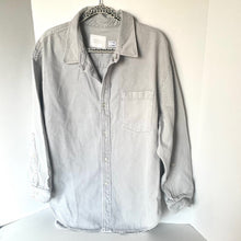 Load image into Gallery viewer, Light gray button-up shirt on a hanger against a white background