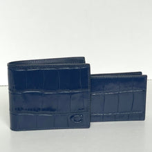 Load image into Gallery viewer, Two blue textured wallets on a white background