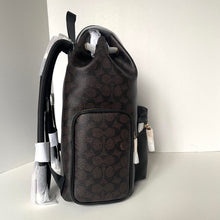 Load image into Gallery viewer, Black patterned backpack on a white background