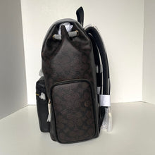 Load image into Gallery viewer, Black backpack with brand logo on a white background