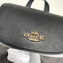 Load image into Gallery viewer, Black Coach handbag with gold logo on a white background