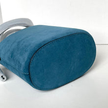 Load image into Gallery viewer, Blue armrest cover on a white chair