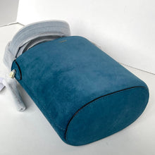 Load image into Gallery viewer, Blue travel pillow on a white surface