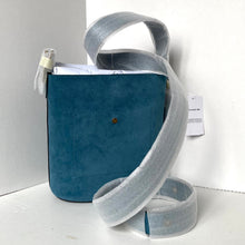 Load image into Gallery viewer, Blue suede handbag with a gray strap on a white background