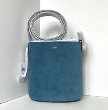 Load image into Gallery viewer, Blue handbag with a strap on a white background
